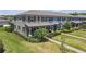 Well-maintained townhome with lush landscaping, sidewalk entry, and covered porch at 4639 Bexley Village Dr, Land O Lakes, FL 34638