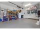 This spacious garage features ample storage space, including shelving and overhead racks at 4639 Bexley Village Dr, Land O Lakes, FL 34638
