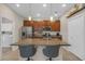 Modern kitchen boasts granite countertops, stainless steel appliances, ample cabinet space, and a breakfast bar at 4639 Bexley Village Dr, Land O Lakes, FL 34638