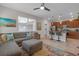 Open living area with a sofa, kitchen island with bar stools, stainless appliances, and lots of light at 4639 Bexley Village Dr, Land O Lakes, FL 34638