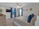 Cozy main bedroom featuring natural light, a ceiling fan, and closet space for a comfortable and functional space at 4639 Bexley Village Dr, Land O Lakes, FL 34638