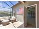 Covered patio with access to a spacious garage, featuring outdoor seating at 4639 Bexley Village Dr, Land O Lakes, FL 34638