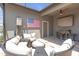 Inviting screened patio with comfortable seating and unique bar area at 4639 Bexley Village Dr, Land O Lakes, FL 34638