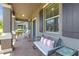 Charming front porch with seating, perfect for relaxing outdoors at 4639 Bexley Village Dr, Land O Lakes, FL 34638