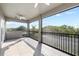 A spacious tiled balcony with railings offers scenic views and includes a ceiling fan for comfort at 5313 Sanderling Ridge Dr, Lithia, FL 33547