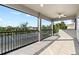 A tiled balcony with railings offers scenic views and includes a ceiling fan for comfort at 5313 Sanderling Ridge Dr, Lithia, FL 33547