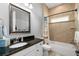 Cozy bathroom with a tiled shower/tub combo, themed shower curtain, and a granite sink vanity at 5313 Sanderling Ridge Dr, Lithia, FL 33547