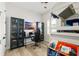 Playful bedroom with built-in bunk bed, desk and chair for homework, and glass-doored display cases at 5313 Sanderling Ridge Dr, Lithia, FL 33547