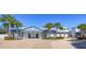 Inviting clubhouse with blue trim, decorative columns, and professional landscaping at 5313 Sanderling Ridge Dr, Lithia, FL 33547
