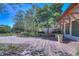 Charming courtyard with beautiful brick pavers, seating, and manicured greenery, offering a relaxing outdoor space at 5313 Sanderling Ridge Dr, Lithia, FL 33547