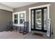 Cozy front porch featuring rocking chairs, a 'Home Sweet Home' doormat, and a welcoming atmosphere at 5313 Sanderling Ridge Dr, Lithia, FL 33547
