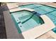 This image displays a luxurious in-ground hot tub with a brick trim, alongside a crystal clear pool at 5313 Sanderling Ridge Dr, Lithia, FL 33547