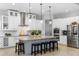 Well-equipped kitchen with granite counters, stainless appliances, and a central island with seating at 5313 Sanderling Ridge Dr, Lithia, FL 33547