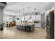 Bright, open kitchen featuring granite countertops, stainless steel appliances, and a spacious center island with bar seating at 5313 Sanderling Ridge Dr, Lithia, FL 33547
