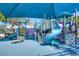 Colorful community playground featuring slides, climbing structures, and a soft, padded surface for safety at 5313 Sanderling Ridge Dr, Lithia, FL 33547