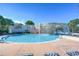 Community pool area showcasing a unique waterfall feature and a sparkling clean pool at 5313 Sanderling Ridge Dr, Lithia, FL 33547