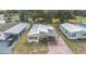 Overhead view of the home with a long driveway and landscaping at 5524 Betmar Dr, Zephyrhills, FL 33542