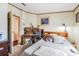 Relaxing bedroom with desk, natural light, and closet space at 5524 Betmar Dr, Zephyrhills, FL 33542