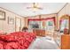 Inviting bedroom featuring a ceiling fan and large window at 5524 Betmar Dr, Zephyrhills, FL 33542