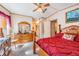 Classic bedroom with bright natural light and dresser at 5524 Betmar Dr, Zephyrhills, FL 33542