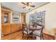 Charming dining area featuring a round table, built in cabinets and lots of natural light at 5524 Betmar Dr, Zephyrhills, FL 33542