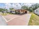 Inviting single-story home boasts a covered carport and well-maintained front yard at 5524 Betmar Dr, Zephyrhills, FL 33542