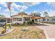 Charming single-story home with a carport and manicured lawn at 5524 Betmar Dr, Zephyrhills, FL 33542
