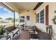 Inviting porch with comfortable seating area, perfect for relaxing outdoors at 5524 Betmar Dr, Zephyrhills, FL 33542