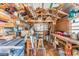 Functional shed featuring shelving and work space at 5524 Betmar Dr, Zephyrhills, FL 33542