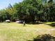 Spacious backyard with sheds, mature trees offering plenty of shade at 5602 N Dormany Rd, Plant City, FL 33565