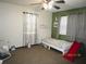 Bedroom features a bed, ceiling fan, and a play area with a slide for recreational enjoyment at 5602 N Dormany Rd, Plant City, FL 33565