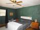 A primary bedroom featuring a bed, ceiling fan, and natural light at 5602 N Dormany Rd, Plant City, FL 33565