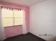 Bedroom with natural light and dark carpet flooring at 5602 N Dormany Rd, Plant City, FL 33565