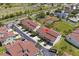 Aerial view of townhome community with tennis courts and green space at 621 Duchess Blvd, Dunedin, FL 34698