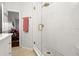 Bathroom featuring tiled walk-in shower with a gold shower head and glass door at 621 Duchess Blvd, Dunedin, FL 34698