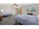 Spacious bedroom featuring two beds, neutral walls, a large window, and tiled floors at 621 Duchess Blvd, Dunedin, FL 34698
