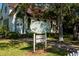 Charming view of historic Andrews Memorial Chapel with well-maintained landscaping and vintage details at 621 Duchess Blvd, Dunedin, FL 34698