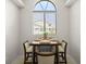 Cozy dining area with a large window and seating for four at 621 Duchess Blvd, Dunedin, FL 34698