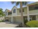 Charming townhouse with well-maintained landscaping and an attached garage at 621 Duchess Blvd, Dunedin, FL 34698