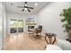 Bright living room features a fireplace and sliding doors leading to a balcony at 621 Duchess Blvd, Dunedin, FL 34698
