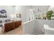 Bright living room featuring light wood floors and staircase at 621 Duchess Blvd, Dunedin, FL 34698