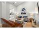 Bright living room featuring light wood floors and new furniture at 621 Duchess Blvd, Dunedin, FL 34698
