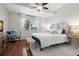 Comfortable main bedroom with a ceiling fan and ample natural light at 621 Duchess Blvd, Dunedin, FL 34698
