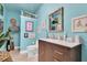 Charming powder room with unique decor, blue walls, and a stylish vanity at 633 Soundview Dr, Palm Harbor, FL 34683