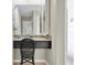 Bathroom vanity area featuring a wicker chair and granite countertop at 633 Soundview Dr, Palm Harbor, FL 34683
