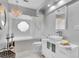 Elegantly designed bathroom with chandelier, soaking tub, and modern vanity at 633 Soundview Dr, Palm Harbor, FL 34683