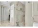 Bathroom featuring a glass-enclosed shower with tiled walls and modern fixtures at 633 Soundview Dr, Palm Harbor, FL 34683