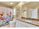 Bathroom featuring a floral shower curtain, granite countertops, and great lighting at 633 Soundview Dr, Palm Harbor, FL 34683