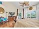 Bedroom with high ceilings, sliding glass door leading to the outside, and comfortable seating at 633 Soundview Dr, Palm Harbor, FL 34683