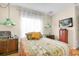 Comfortable bedroom with vintage lamps, hardwood floors, and lots of storage at 633 Soundview Dr, Palm Harbor, FL 34683